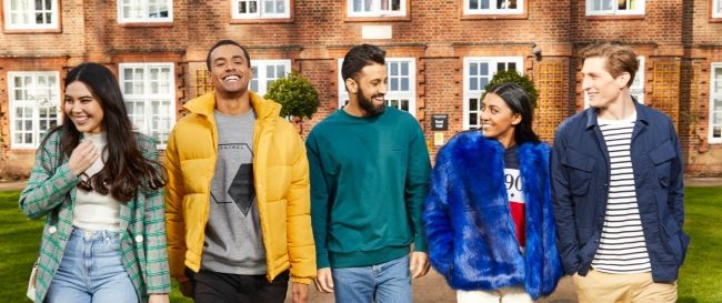 Regent's home page - brand 2018 Students walking on campus